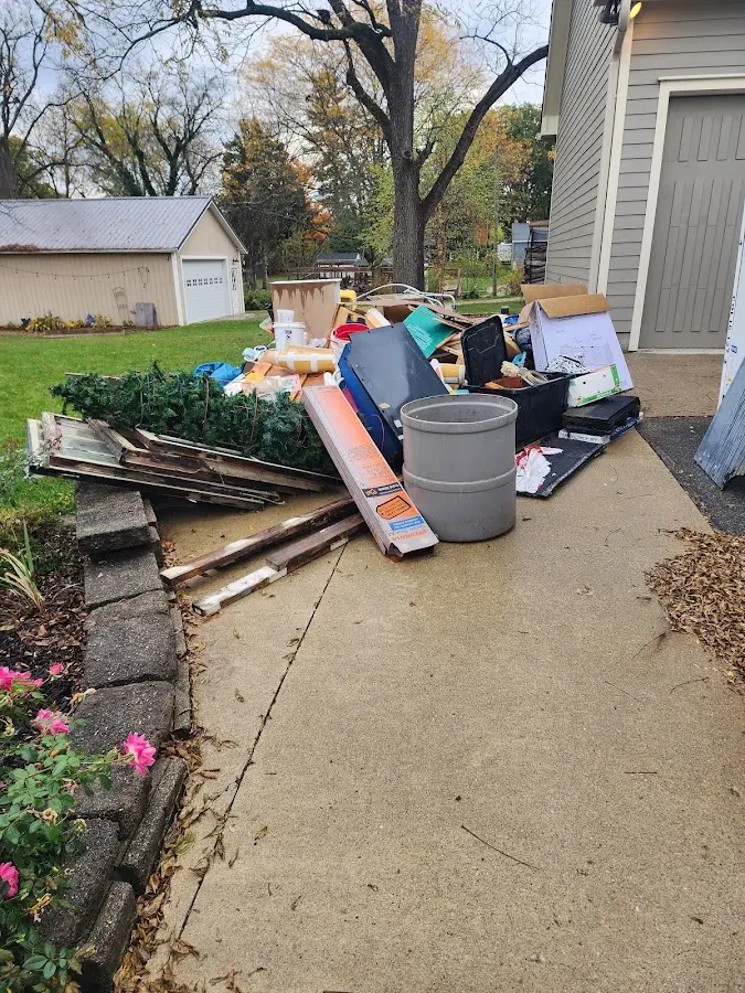 Dumpster being loaded with debris for 3 Yard Dumpster Rental in Altoona